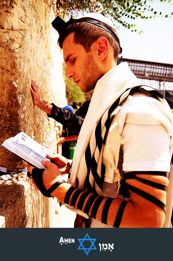 Young Man Praying Tefillin Kotel